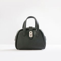 Beautiful black leather female fashion bag isolated on white background