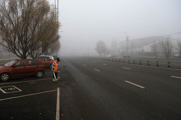 Cleaning the city during fog