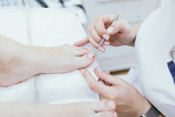 Professional pedicure. Client on medical pedicure procedure. Podiatry clinic. Podology. Healthcare....