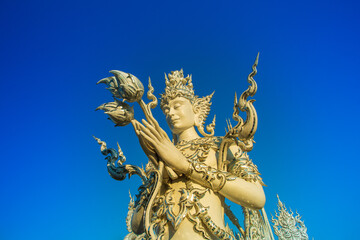 Fototapeta na wymiar Wat Rong Khun,Chiangrai,in the Thailand on blue sky background.(Wide-angle lens)