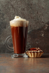 Coffee drink with whipped cream and chocolate cake.