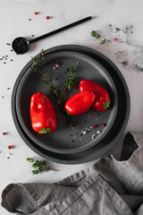 Small ripe red pepper on a plate