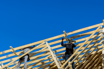 Construction building contractor working on the roof