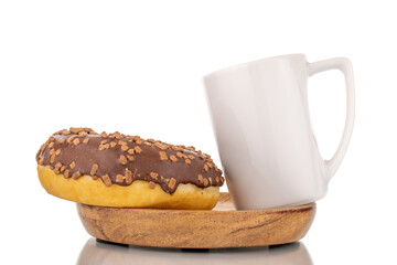 One sweet chocolate donut on a wooden saucer with a white cup , macro, isolated on white.