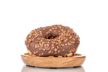 One sweet chocolate donut on a wooden saucer, macro, isolated on white.