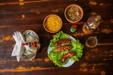 Delicious Food Contemporary Classic Dish Plate Menu Lunch Dinner Chicken BBQ Pork Sausage Bacon Regional Native Dessert on a WoodenTable