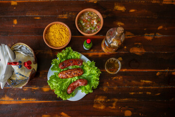 Delicious Food Contemporary Classic Dish Plate Menu Lunch Dinner Chicken BBQ Pork Sausage Bacon Regional Native Dessert on a WoodenTable