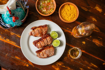 Delicious Food Contemporary Classic Dish Plate Menu Lunch Dinner Chicken BBQ Pork Sausage Bacon Regional Native Dessert on a WoodenTable