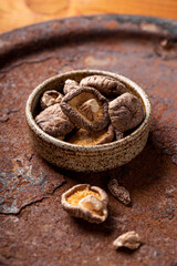 Dried shiitake mushrooms in a plate vertical photo