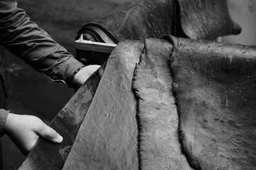 One of the first stages of production of rubber products at the plant. Close-up of raw material...