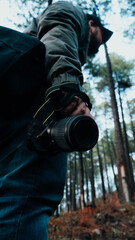 man in the forest with a photo camera