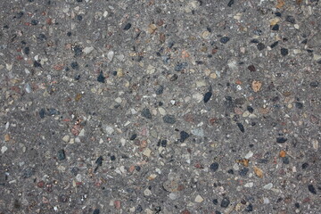 Asphalt road with small stones texture background top view