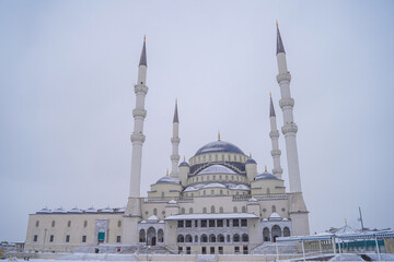 Fototapeta na wymiar Great Mosque and Minarets in Snowy Weather