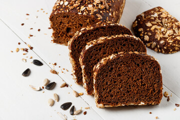 Pieces of whole grain bread with sunflower and flax seeds