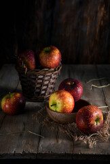 Red apples on a rustic wooden table