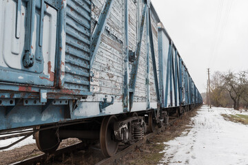 Fototapeta premium Blue freight train in winter.