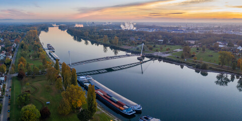 Bridge of the two riverbanks over Rhine river between Kehl and Strasbourg Germany France aerial...