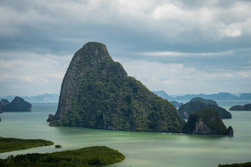 View from above, aerial view of the beautiful Phang Nga Bay (Ao Phang Nga National Park) with the sheer limestone karsts that jut vertically out of the emerald-green water, Thailand