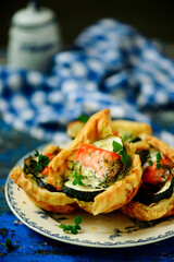 Salmon and zucchini tartlets.selective focus