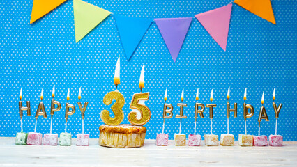 Congratulations on your birthday from the letters of candles number 35 on a blue background with...