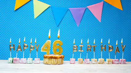 Congratulations on your birthday from the letters of the candles number 46 on a blue background...