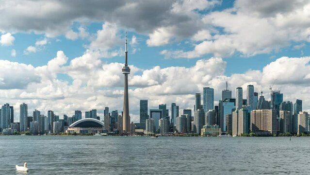 Toronto, Ontario, Canada, time lapse view of iconic Toronto skyline and Lake Ontario by day during summer.	