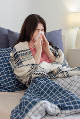 girl with runny nose in bed