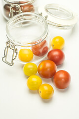 Colorful tomatoes with glass jar