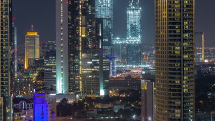 Fototapeta na wymiar Aerial view of Dubai International Financial Centre district skyscrapers night timelapse