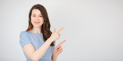 Woman pointing at something with her fingers. woman announces something. job search 