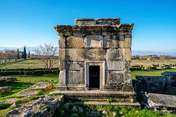The necropolis of Hierapolis is filled with sarcophagi, rock tombs, was an ancient Greek city located on hot springs in classical Phrygia in Anatolia and currently comprise an archaeological museum.