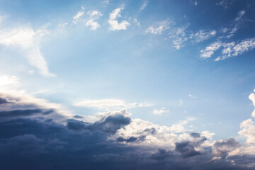 Obraz premium clouds on the blue sky in morning light. stormy weather approaching in summer