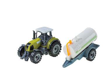 Close up view of toy tractor and water trailer isolated on white background.