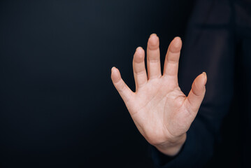 Open woman's hand, palm up isolated on black background. Mock up. Copy space. Template. Blank.