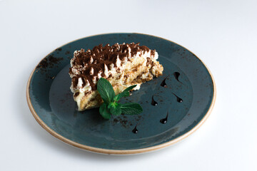 Classic Italian tiramisu cake isolated on white