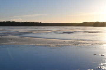 Sunset at frozen lake