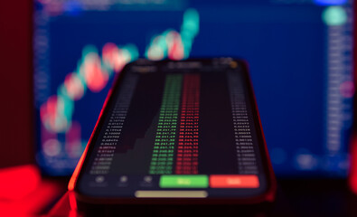 Buy and sell crypto. Cryptocurrency price and graph evolution. Market price of Bitcoin, last day changes. View of Binance app and the Trading View chart. Romania, 2022.