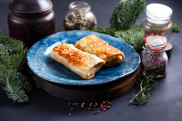 Homemade russian pancakes with meat closeup. Closeup restaurant serving of traditional maslenitsa meal.