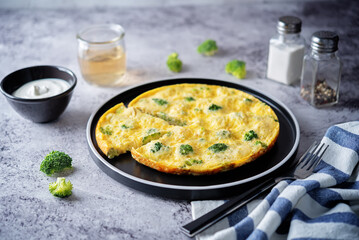 Broccoli Frittata in a plate with sauce