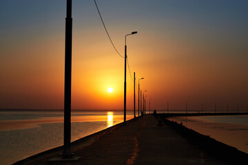 Sunset sea with pier. Summer landscape.