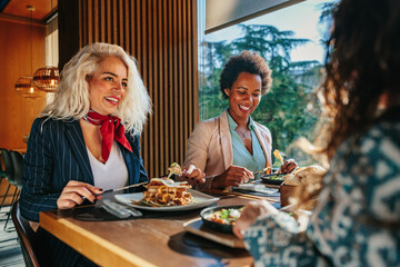 Three business women having lunch break