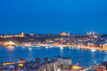 Night aerial view of Istanbul cityscape and bridges over the city river, Turkey.