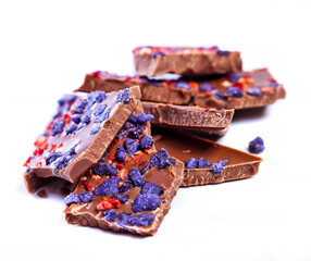 Chocolate with strawberries and flowers violets
