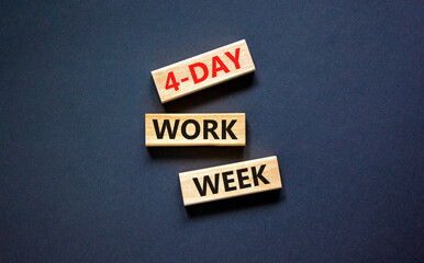 4-day work week symbol. Concept words 4-day work week on wooden blocks on beautiful black table...