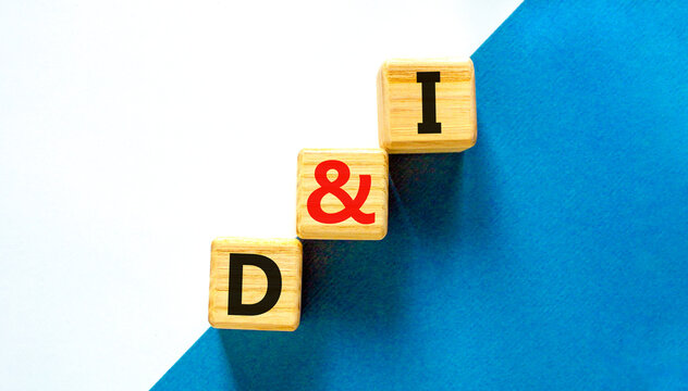 D and I, Diversity and inclusion symbol. Concept words D and I, diversity and inclusion on wooden cubes on beautiful white background. Business, D and I, diversity and inclusion concept.