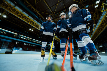 Fototapeta na wymiar Junior ice hockey at indoors rink