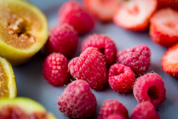 Fresh berries on a grey plate