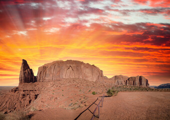 Sunset sky with streaks of red color over Monument Valley, a region of the Colorado Plateau between Arizona and Utah.