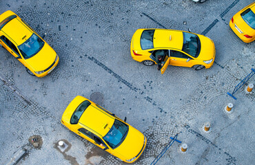 Yellow city taxes, overhead aerial view of yellow cabs.