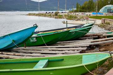 Fototapeta na wymiar pleasure boats on the summer lake shore